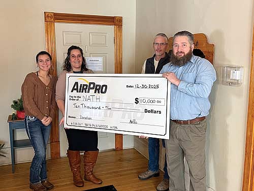 Those attending the check presentation are, from left, Frederick Place staff members Ashlynn Klabunde and Abbey Lukowski with AirPro representatives Rod Randolph and Jason Giese. (Contributed photograph)