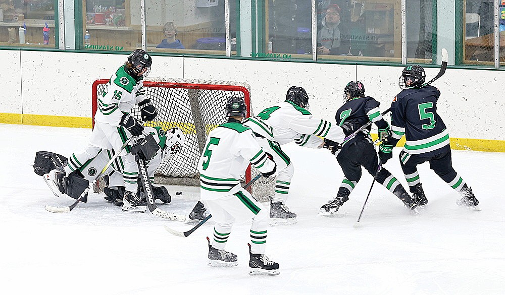 Manistique’s Levi Vruggink (2) scores on a breakaway against Rhinelander goalie Connor McGee during the third period of a non-conference boys’ hockey game at the Rhinelander Ice Arena Tuesday, Dec. 30. The goal broke a 1-all tie and started string of six unanswered goals for the Emeralds over the final 8 minutes, 46 seconds of regulation as they went on to a 7-1 win. (Bob Mainhardt for the River News)