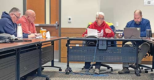 Vilas County supervisor and forestry, recreation and land committee member Dan Swiecichowski, left, county board chairman Jerry Burkett, committee chair Holly Tomlanovich and forestry department director Chad Keranen at the Jan. 6 meeting of the committee. (Photo by Brian Jopek/Lakeland Times)