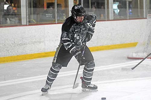 Spencer Swedberg controls the puck in the third period of a conference game against Medford Monday, Jan. 12 at the Lakeland Hawks Ice Arena in Minocqua. (Photo by Brett LaBore/Lakeland Times)