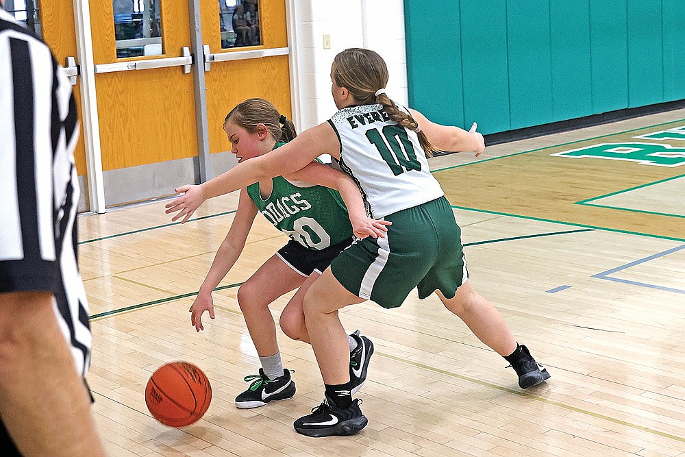 Aubrey Prom dribbles against tight defense for the Hodag fourth graders.