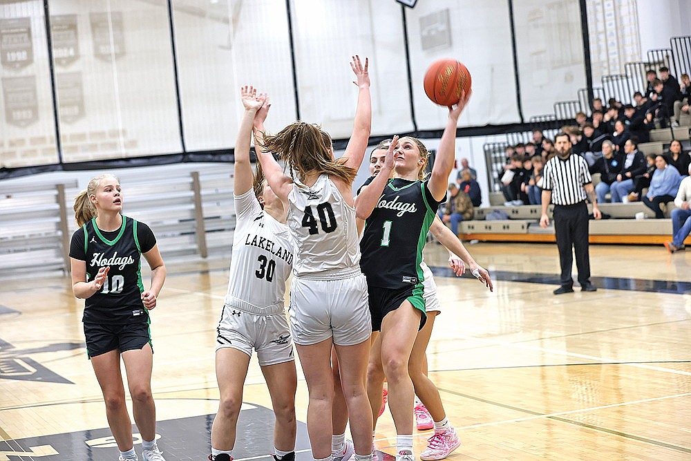 Rhinelander’s Aubryn Clark puts up a shot against Lakeland’s Sophie Wiczek (30) and Ava Evenhouse (40) during the first half of a GNC girls’ basketball game in Minocqua Tuesday, Jan. 13. Clark scored a game-high 22 points in Rhinelander’s 53-29 win. (Bob Mainhardt for the River News)