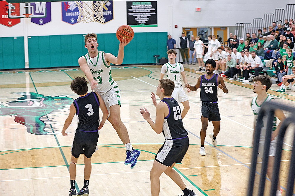 Rhinelander’s Evan Shoeder is called for an offensive foul against Mosinee’s Carson Balgord during the first half of a GNC boys’ basketball game against Mosinee Friday, Jan. 16. (Bob Mainhardt for the River News)