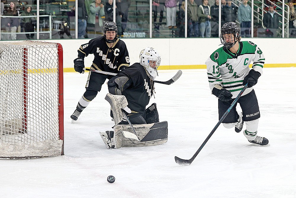 Rhinelander’s Drake Nelson track down the puck in front of Lakeland goalie Cam Bernard during the first period of a GNC boys’ hockey game in Rhinelander Thursday, Jan. 15. (Bob Mainhardt for the River News)