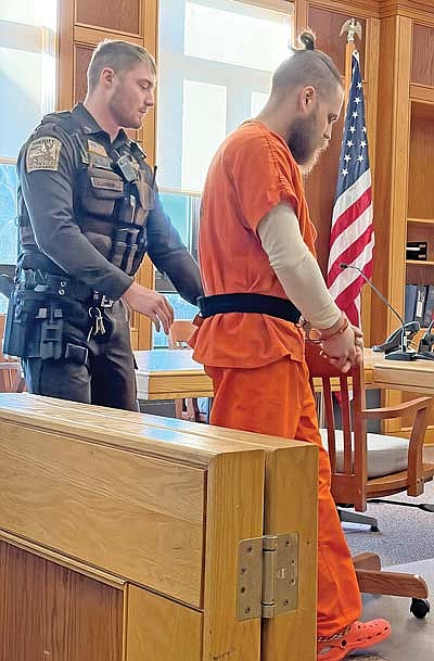 Cole Lehman, left, a deputy with the Oneida County Sheriff’s Office, escorts Caleb Meyer into the courtroom on Tuesday, Jan. 20. (Photo by Brian Jopek/Lakeland Times)