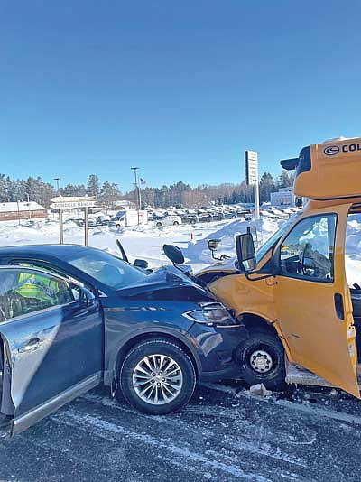 The 2017 Lincoln MKX and a school bus belonging to Bowen’s Bus Service of Rhinelander involved in a collision on State Highway 47 near the intersection of County Highway K in Crescent on Monday, Jan. 19. (Contributed photograph)
