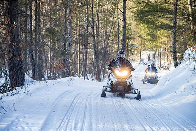 Operating a snowmobile off-trail can be dangerous and cause damage to private property. (Contributed photograph)