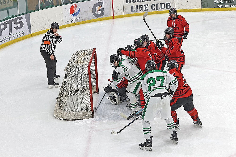 Rhinelander’s Drake Nelson pokes home a loose puck for a goal during the second period of a GNC boys’ hockey game against Medford at the Rhinelander Ice Arena Tuesday, Jan. 20. Nelson’s goal put Rhinelander up 3-1 and the Hodags went on to win, 3-2. (Bob Mainhardt for the River News)