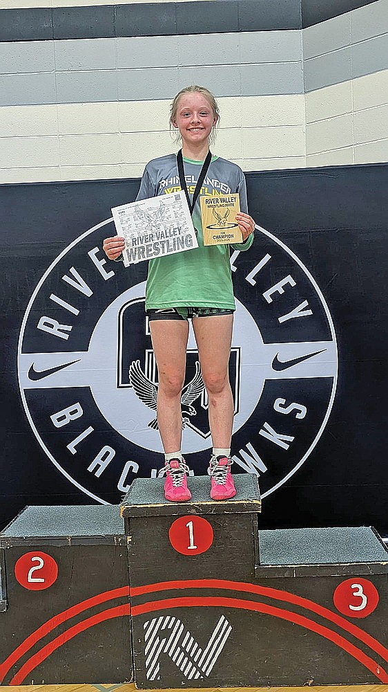 Rhinelander’s Cassidy Lindner stands on the podium after winning the 120-pound bracket, and being named the most outstanding female wrestler at the River Valley Invite Saturday, Jan. 17. (Contributed photograph)