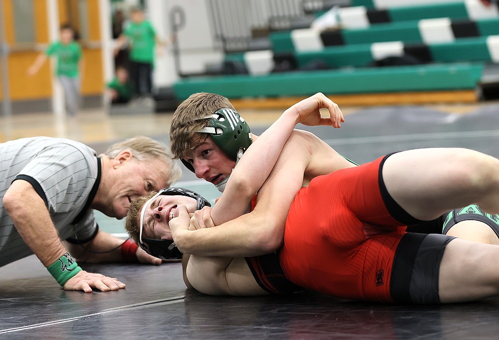 Rhinelander’s Hoyt Dantoin puts Medford’s Cory McVicker in a headlock during a GNC boys’ wrestling dual meet at the Jim Miazga Community Gymnasium Thursday, Jan. 22. (Bob Mainhardt for the River News)