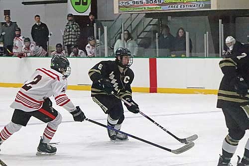 Lawson Bain controls possession in a conference game against Medford Tuesday, Jan. 27 at Simek Recreation Center in Medford. Bain led all players with two goals scored. (Photo by Alex Wilson/Star News)