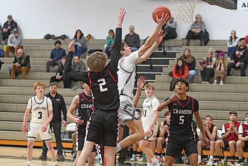 Lincoln Friedley makes a layup in the first half of a non-conference game against Crandon Tuesday, Jan. 27 at Ted Voigt Court in Minocqua. Friedley scored a varsity career-high 19 points. (Photo by Brett LaBore/Lakeland Times)