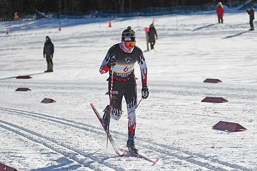 Parker McKinney skis up a hill towards the finish line during the Wisconsin Nordic Ski League Northern Conference Championship Tuesday, Jan. 27 at Minocqua Winter Park. McKinney finished second overall at 18:38. (Photo by Brett LaBore/Lakeland Times)