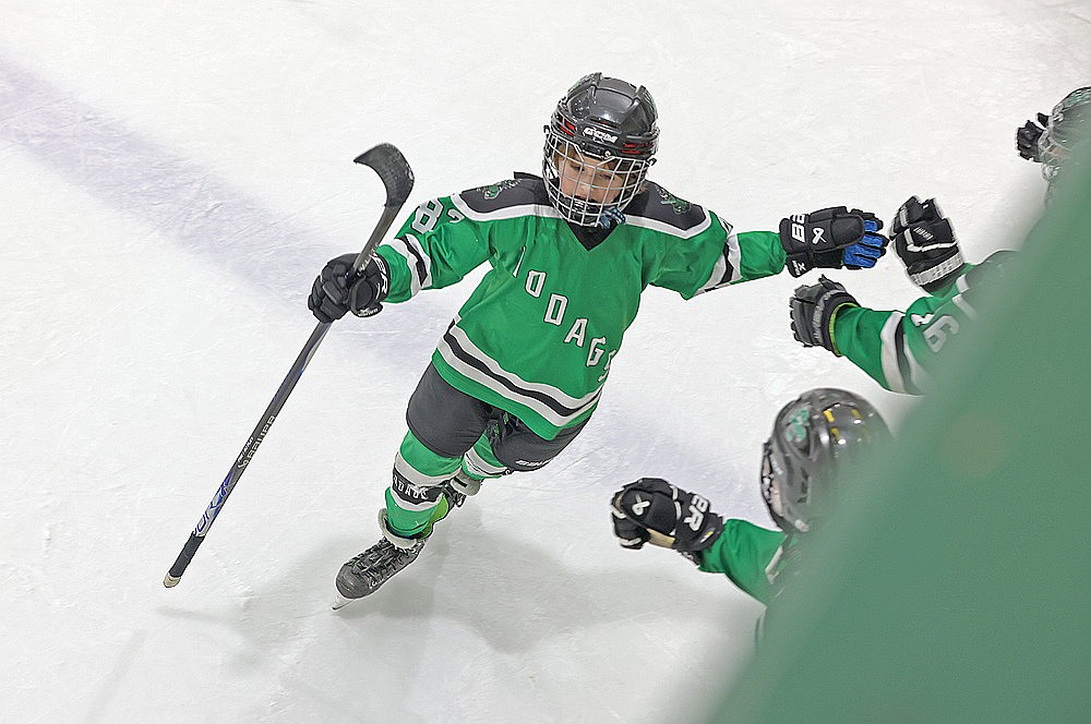 Abraham Campbell receives congratulations after scoring a goal for the Hodags against Shawano Friday, Jan. 23.