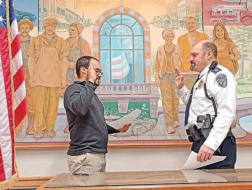 Now in his 19th year with the Rhinelander Police Department, Josh Chiamulera, right, was sworn in as the new chief of police by city clerk Austyn Zarda on Thursday, Jan. 29, at Rhinelander City Hall. (Photo by Ardith Carlton/River News)