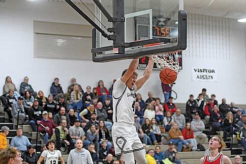 Brooks Lenz throws down a dunk in the second half of a conference game against Medford Friday, Jan. 30 at Ted Voigt Court in Minocqua. (Photo by Brett LaBore/Lakeland Times)