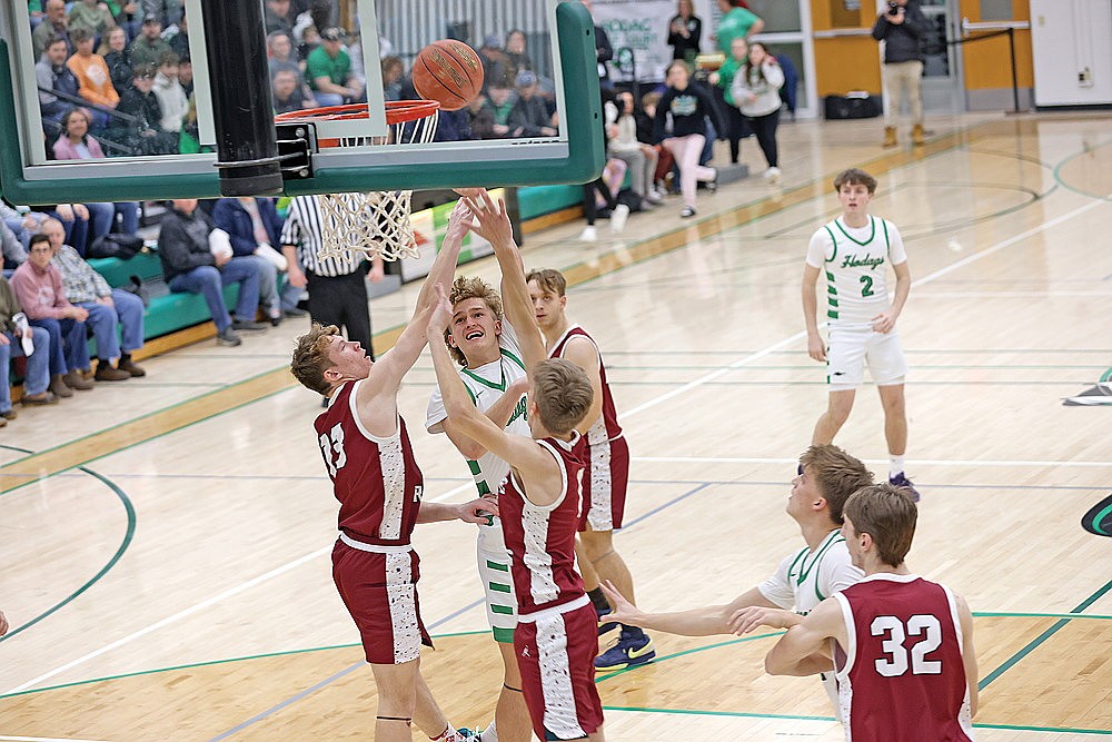 Rhinelander’s Abe Gretzinger puts up a shot between Antigo’s Scott Hagerty (13) and Zander Zwirschitz (1) during the first half of a GNC boys’ basketball game at the Jim Miazga Community Gymnasium Friday, Jan. 30. Gretzinger had 13 points for Rhinelander in a 69-46 win. (Bob Mainhardt for the River News)