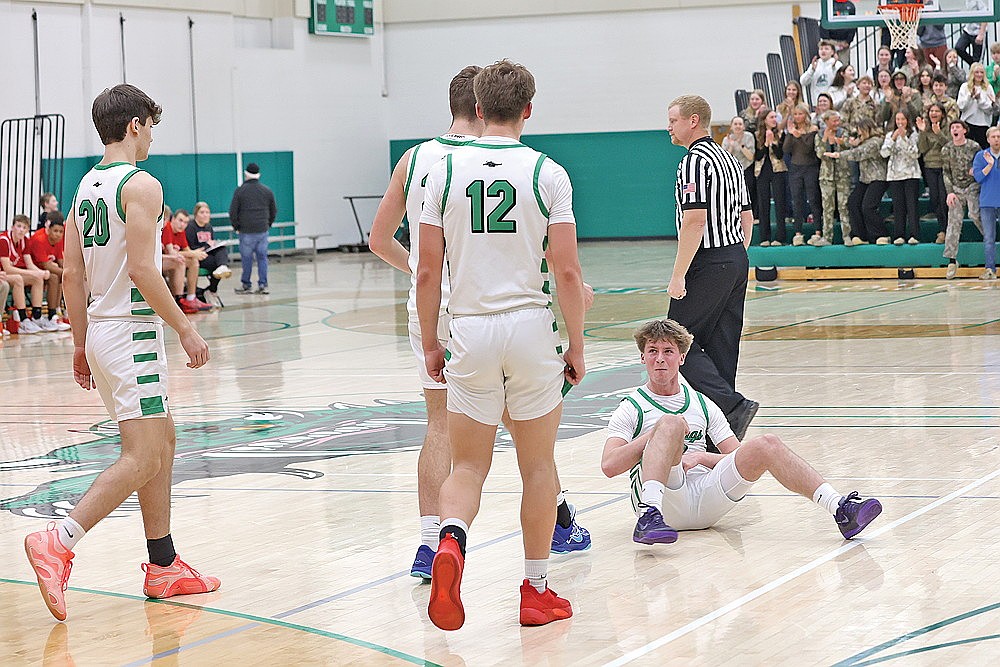 Devon Feck, sitting, smiles after getting fouled on a made 3-pointer during the second half of a non-conference boys’ basketball game against Wisconsin Rapids at the Jim Miazga Community Gymnasium Tuesday, Feb. 3. Feck scored 28 points in the Hodags’ 63-44 victory. (Bob Mainhardt for the River News)