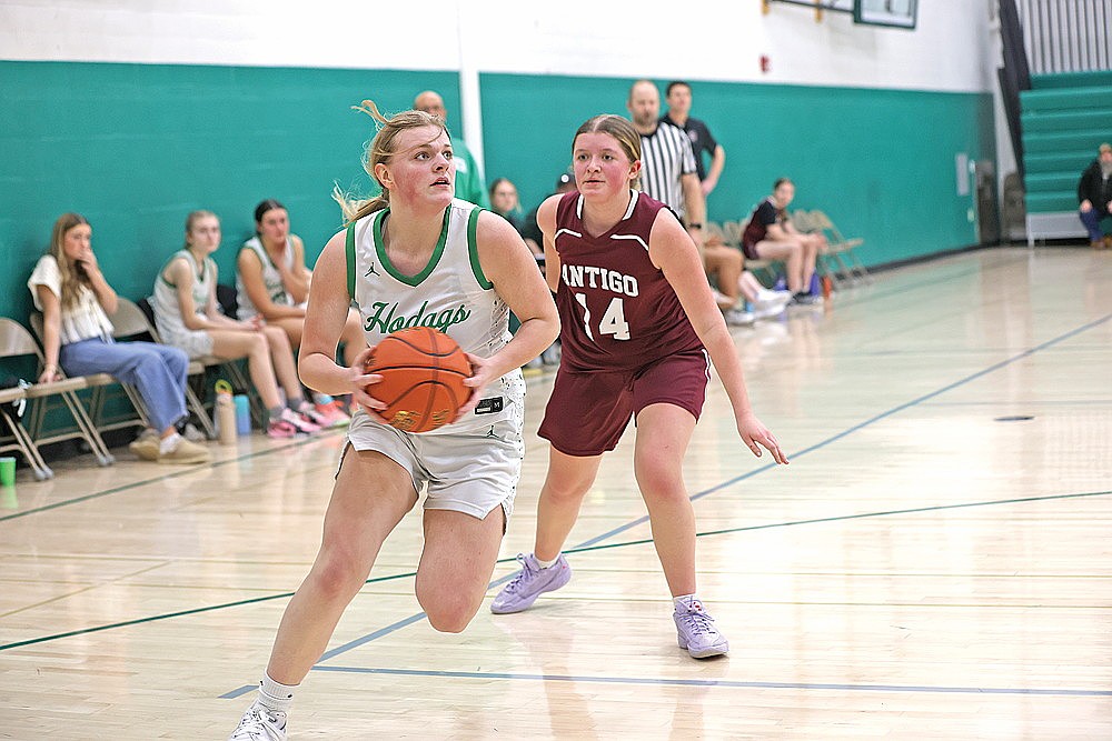 Miranda Raduechel drives to the basket for the girls’ JV team.