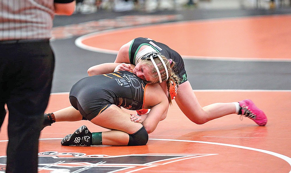 Rhinelander’s Cassidy Lindner wrestles Plymouth’s Megan Schuenemann during the Queen of the Mat Invite in Marshfield Saturday, Jan. 31. (Contributed photograph)