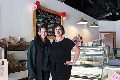 Helmed by Brittany Bex, left, and her mother, Anita Theiler, gluten-free bakery Almond & Berry in Rhinelander has sold creations including more than 3,000 cinnamon rolls since opening last June. (Photo by Ardith Carlton/River News)