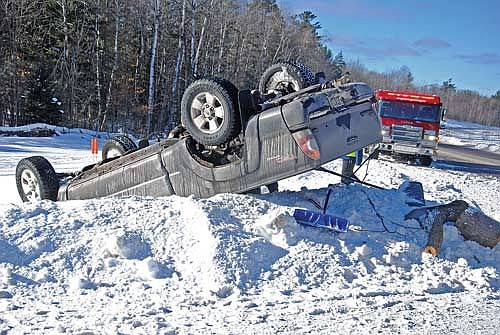 Firefighters from the Lake Tomahawk fire department were among the emergency services and law enforcement personnel called to a rollover at the intersection of Fawn Lake Road and State Highway 47 on Tuesday, Feb. 3. (Photo by Brian Jopek/Lakeland Times)