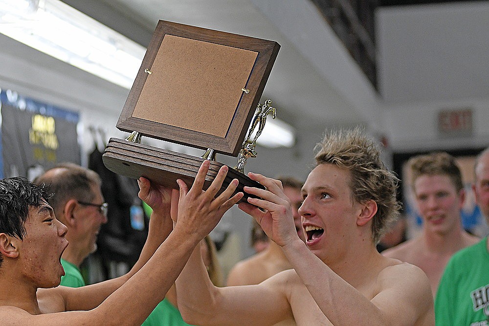 Rhinelander’s Charlie Antonuk, left, and Judson O’Malley, lift the Great Northern Conference championship trophy after the Hodags won the GNC boys’ swim meet in Minocqua Friday, Feb. 6. Rhinelander won 10 of 11 events and earned its eighth consecutive conference title. (Brett LaBore/Lakeland Times)