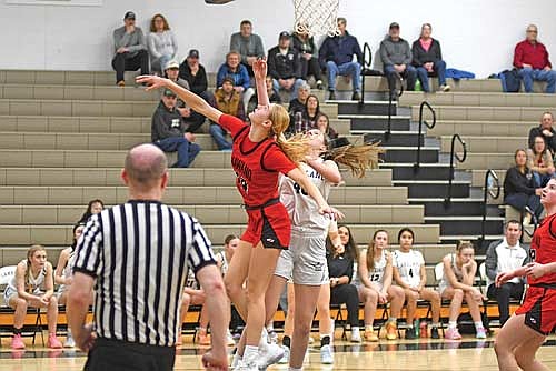 Ava Evenhouse gets a shot up before Shawano’s Leah Nordin can get a hand on it in the second half of a non-conference game Monday, Feb. 9 at Ted Voigt Court in Minocqua. Nordin led all scorers with 36 points. (Photo by Brett LaBore/Lakeland Times)