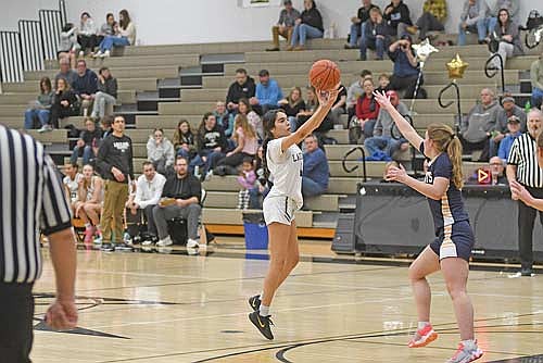 Anisha Williams makes a 3-pointer in the first half of a conference game against Tomahawk Friday, Feb. 13 at Ted Voigt Court in Minocqua. (Photo by Brett LaBore/Lakeland Times)