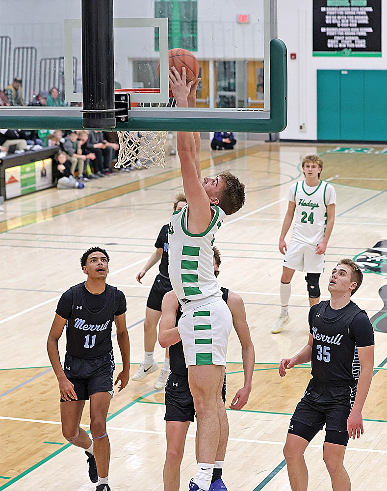 Rhinelander’s Evan Shoeder dunks the basketball during the first half of a GNC boys’ basketball game against Merrill at the Jim Miazga Community Gymnasium Friday, Feb. 13. Shoeder scored 16 points in the Hodags’ 62-53 win. (Bob Mainhardt for the River News)