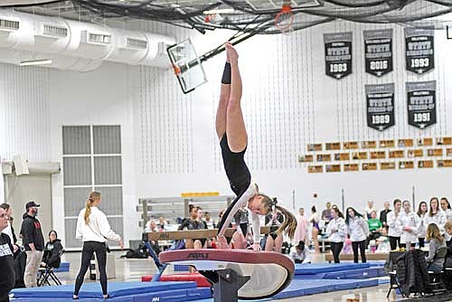 Malin Awker powers herself off the vault during the Great Northern Conference Small Division meet Saturday, Feb. 21 at the Lakeland Union High School fieldhouse in Minocqua. Awker finished runner-up on vault with a score of 8.5. (Photo by Brett LaBore/Lakeland Times)