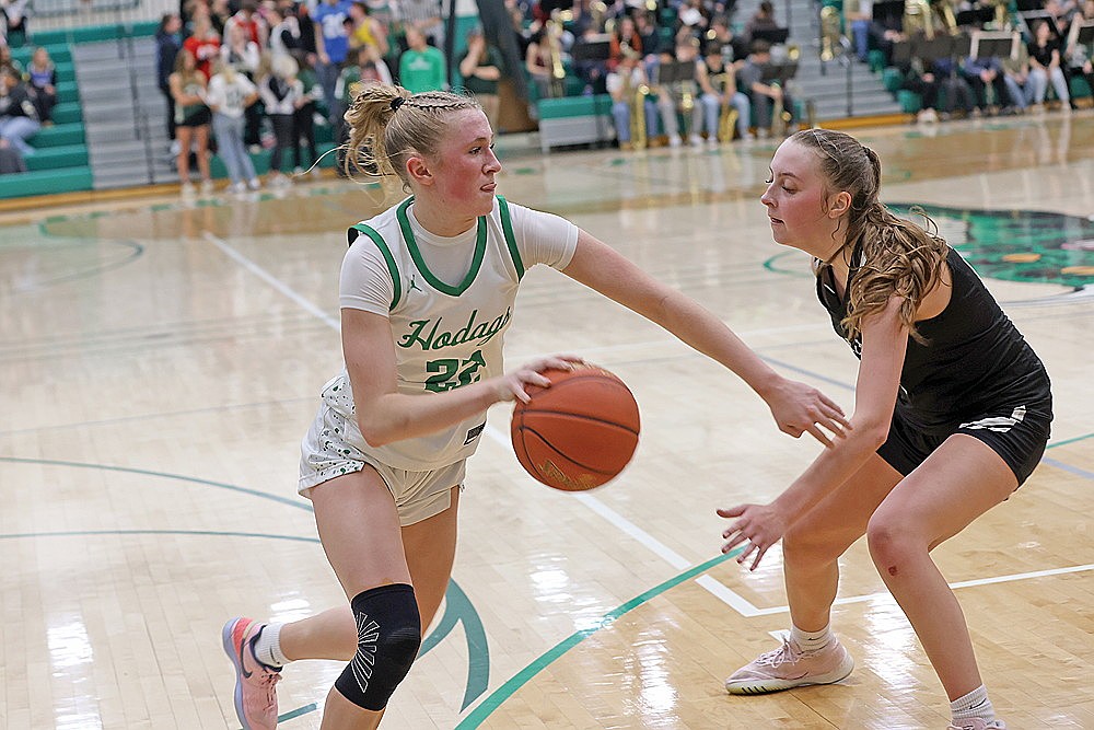 Rhinelander’s Vivian Lamers drives against Lakeland’s Savanah Kemnitz during the second half of a GNC girls’ basketball game at the Jim Miazga Community Gymnasium Friday, Feb. 20. Lamers had 10 points and 13 rebounds in the Hodags’ 57-33 victory. (Bob Mainhardt for the River News)