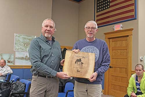 Volunteer city forester Tom Jerow, right, received the Wisconsin Urban Forestry Leadership Award from Rex Zemke of the Wisconsin Urban Forestry Council at the Monday, Feb. 23 Rhinelander city council meeting. (Photo by Ardith Carlton/River News)