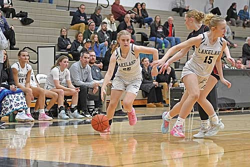 Carmen Istudor drives the ball inside the arc in the second half of a WIAA Division 2 regional quarterfinal game against Wausau East Tuesday, Feb. 24 at Ted Voigt Court in Minocqua. Istudor scored a varsity career-high four points. Hailey Carlson (15) is also pictured. (Photo by Brett LaBore/Lakeland Times)