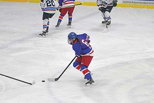 Laine Jelinski skates up the ice in the first period of a WIAA sectional final against Superior Saturday, Feb. 28 at the Hayward Sports Center. (Photo by Brett LaBore/Lakeland Times)