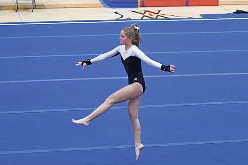 Malin Awker goes through her floor routine during a WIAA Division 2 sectional meet Friday, Feb. 27 at Sheldon Fieldhouse in Antigo. Awker advanced to state in the all-around and vault. (Photo by Brett LaBore/Lakeland Times)