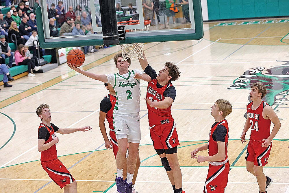 In this Jan. 27, 2026 file photo, Rhinelander’s Devon Feck drives to the basket against Wausau East’s Robbie Anguilli during a non-conference boys’ basketball game at the Jim Miazga Community Gymnasium. The Hodags will host the Lumberjacks again tonight in a WIAA D2 regional semifinal, with the winner playing again tomorrow against either Menomonie or Merrill. (Bob Mainhardt for the River News)