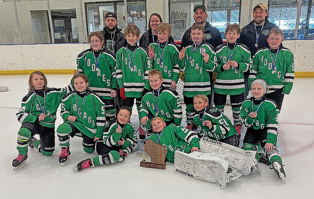 The Rhinelander Ice Association’s Squirt B hockey team poses for a photograph after finishing third at the WAHA Squirt 3B state tournament in Merrill Sunday, March 1. Sitting, at bottom, are Colton Marshall and Ryan Jopek. Kneeling in the first row are Seamus Heath, Jessa Flick, Luke Ziolkowski, Marty Ponik and Kiva King. Standing, in the second row, are Saylor Ramos, Wyatt Sedgeman, Jaxson Krueger, Elijah Disher, Mercer Wanta and Hudson Grant. In the back row are coaches Jay Ramos, Jessica Marshall, Josh Pyrchalla and Joe Ponik. (Brian Jopek/Lakeland Times)