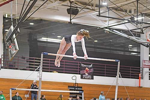 Malin Awker goes through her uneven bars routine during a WIAA Division 2 sectional meet Friday, Feb. 27 at Sheldon Fieldhouse in Antigo. (Photo by Brett LaBore/Lakeland Times)