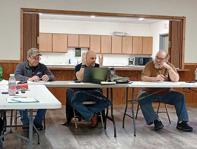 Town board members, from left, Rich Hirman, Casey Crump and Jerome Pokorny, discuss a point at a Stella town board meeting Tuesday, March 3.
(Photo by Ardith Carlton/River News)