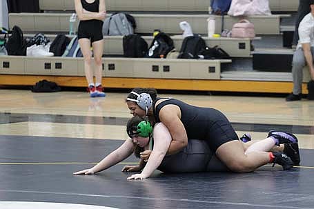 In this Jan. 12, 2026 file photo, Kady Lohoff, top, gets in position against Rhinelander’s Miranda Daab during a GNC/WVC meet at the Lakeland Union High School fieldhouse in Minocqua. Lohoff won a regional title and finished runner-up at the conference meet in her weight class. (Photo by Jeremy Mayo/River News)