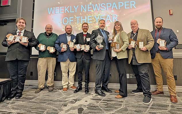 Those attending the awards presentation are, from left, Jake Schexnaydre, Brian Jopek, Trevor Greene, Brett LaBore, Gregg Walker, Heather Holmes, Dean Hall and Michael Strasburg. (Photo by Ardith Carlton/River News)