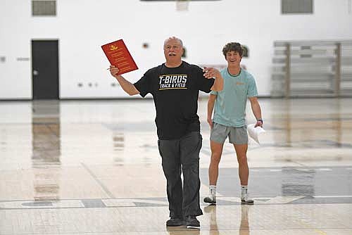Greg Eichelkraut instructs student-athletes with Tyson Redman looking on during the first day of practice Monday, March 9 at the Lakeland Union High School fieldhouse in Minocqua. (Photo by Brett LaBore/Lakeland Times)