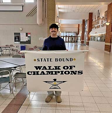 Talan Pockat is celebrated with the Walk of Champions Thursday, March 5 at Lakeland Union High School in Minocqua. Pockat tied for 57th at state with a three-game total of 582. (Contributed photograph)
