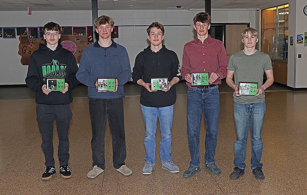 Rhinelander High School boys’ wrestling team award winners, from left to right, Michael Tredupp, Gage Anderson, Ivan Loka, Hoyt Dantoin and Noah Monk, pose with their awards following the team’s banquet in the James Williams Middle School commons Tuesday, March 10. (Bob Mainhardt for the River News)