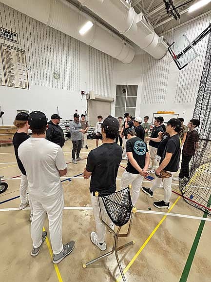 Coach Adam Bremer addresses the baseball team during the first day of the season Monday, March 23 at the Lakeland Union High School fieldhouse in Minocqua. (Photo by Brett LaBore/Lakeland Times)