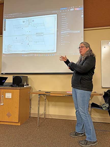 Michelle Guoin, project development manager with the Wisconsin Department of Transportation, answers a question during a public information meeting in the activity room at the Minocqua public library on Monday, March 23. (Photo by Brian Jopek/Lakeland Times)