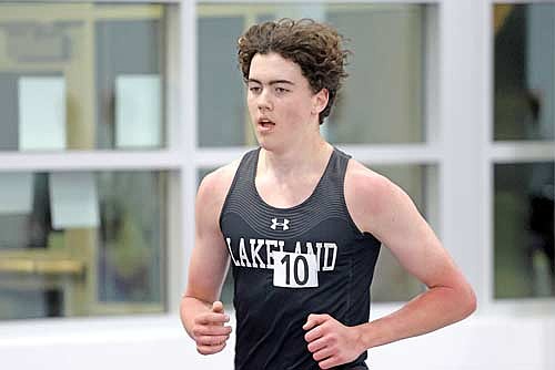 Barrett Eggen takes part in the 3,200-meter run during the Oredocker Large School Indoor Invite Tuesday, March 24 at Ashland High School. (Photo by Jeremy Mayo/River News)