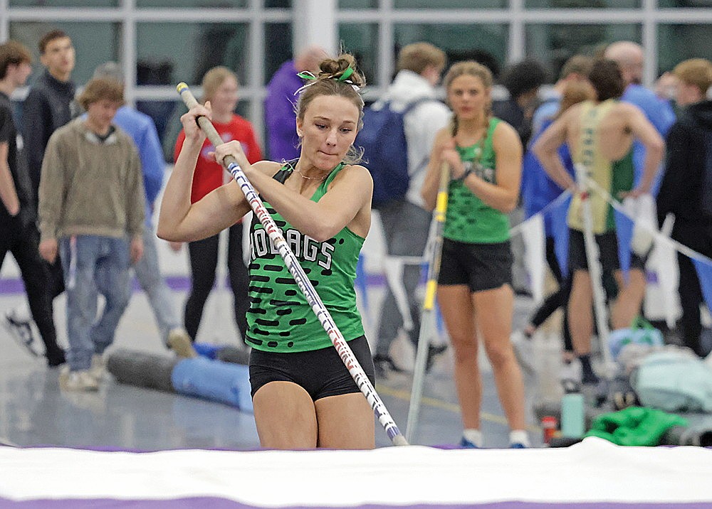 Rhinelander Emeline Hintz pole vaults during the Oredocker Large School Invite track meet in Ashland Tuesday, March 24. Hintz and teammate Macy Myers, background, both cleared 10 feet and finished 1-2 in the event. (Jeremy Mayo/River News)