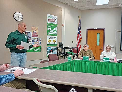 At their meeting March 23, DNR forester John Gillen, left, told the School District of Rhinelander school board about a timber sale being planned for 39 acres of the school forest’s aspen. (Photo by Ardith Carlton/River News)